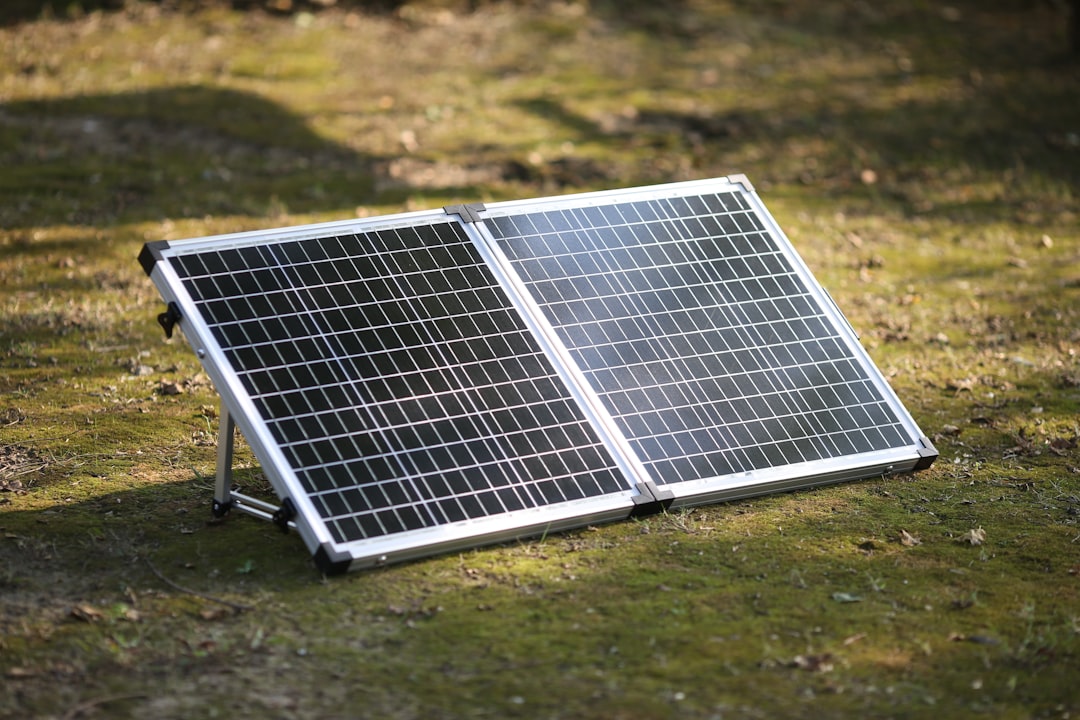 a-solar-panel-on-a-grass-field-ntj-nw7oua